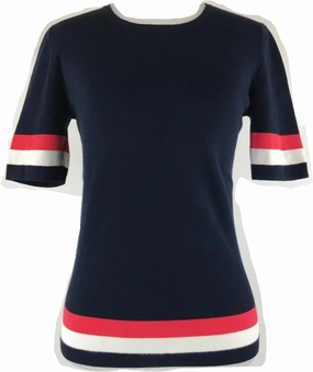 Cabi Hampton Shell Knit Top, is Navy with red and White Stripe at Sleeve and Hem.