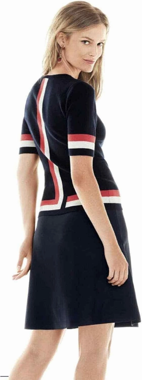 Cabi Hampton Shell Knit Top, is Navy with red and White Stripe at Sleeve and Hem.