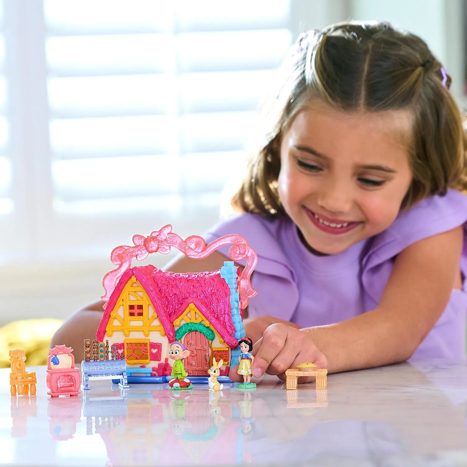 DISNEY STORE Official Snow White Cottage Micro Play Set, Micro Toy Set Includes Snow White and Dopey Micro Figures, Travel Toy Portable Playset with Handle, Travel Toys with Surprise Reveals